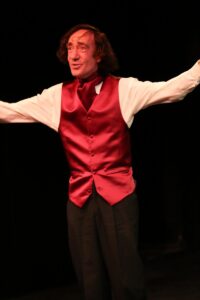 Chopin standing with both arms flung wide